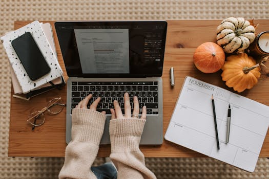 laptop with a financial planner and coffee