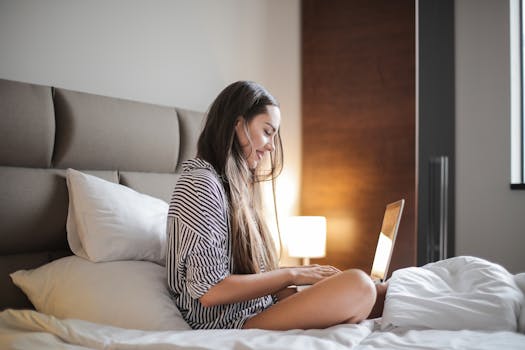 image of a woman using a laptop for blogging