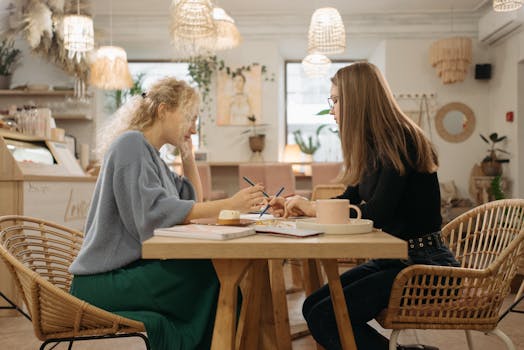 A woman brainstorming ideas at a sunny cafe