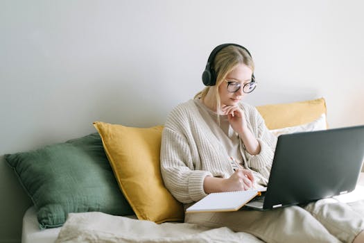 a woman typing on a laptop