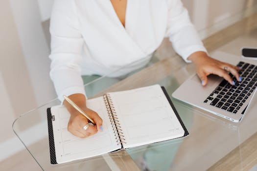 A woman writing in a notebook