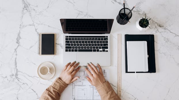 image of a woman using her laptop to blog